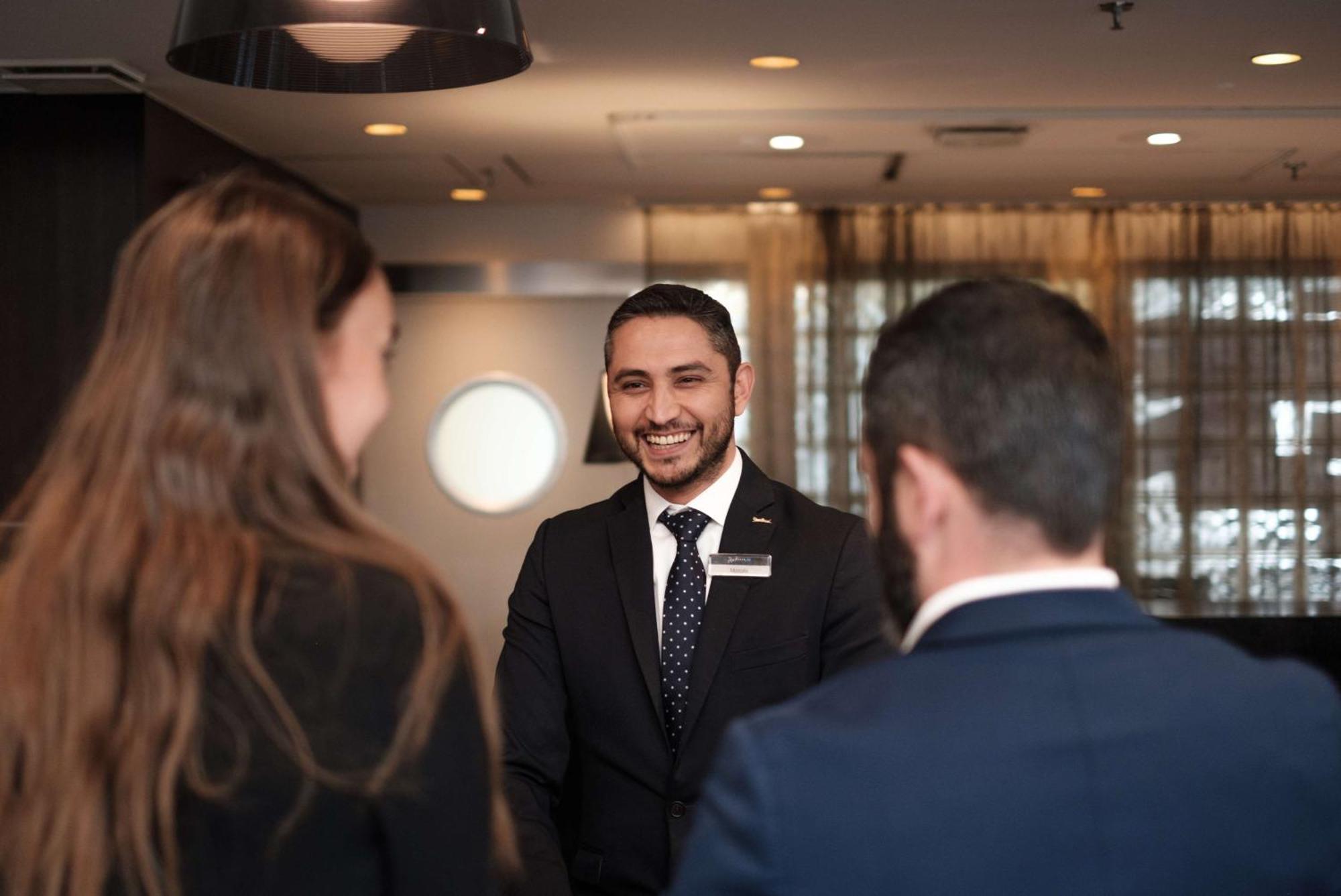 Radisson Blu Airport Terminal Hotel Arlanda Exterior photo Receptionist at a luxury hotel